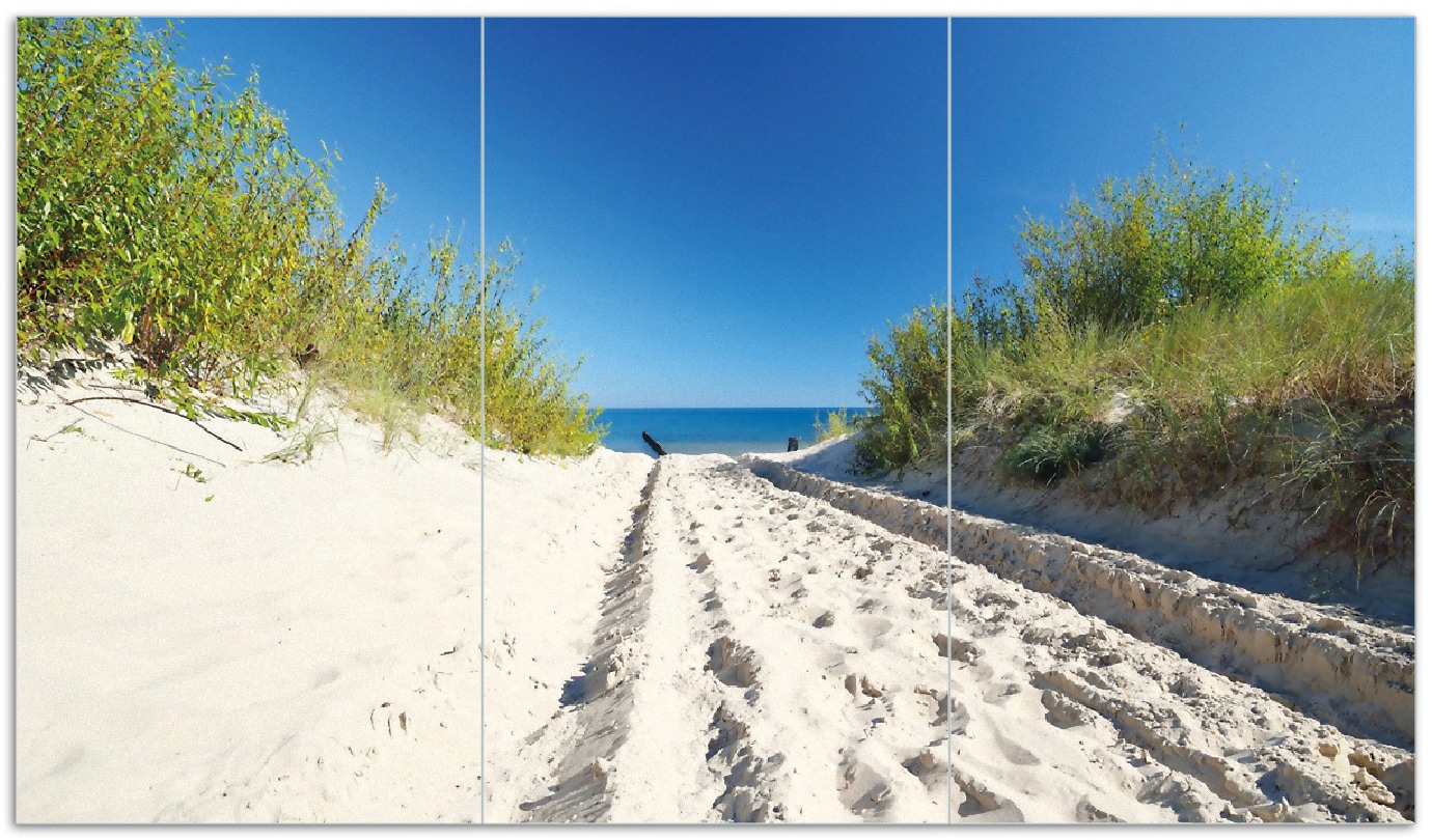 Wallario Herdabdeckplatte 90 x 52 cm (BxH), 1-teilig Auf dem Sandweg zum Strand - Blauer Himmel &uuml;ber dem Meer - Bild 1
